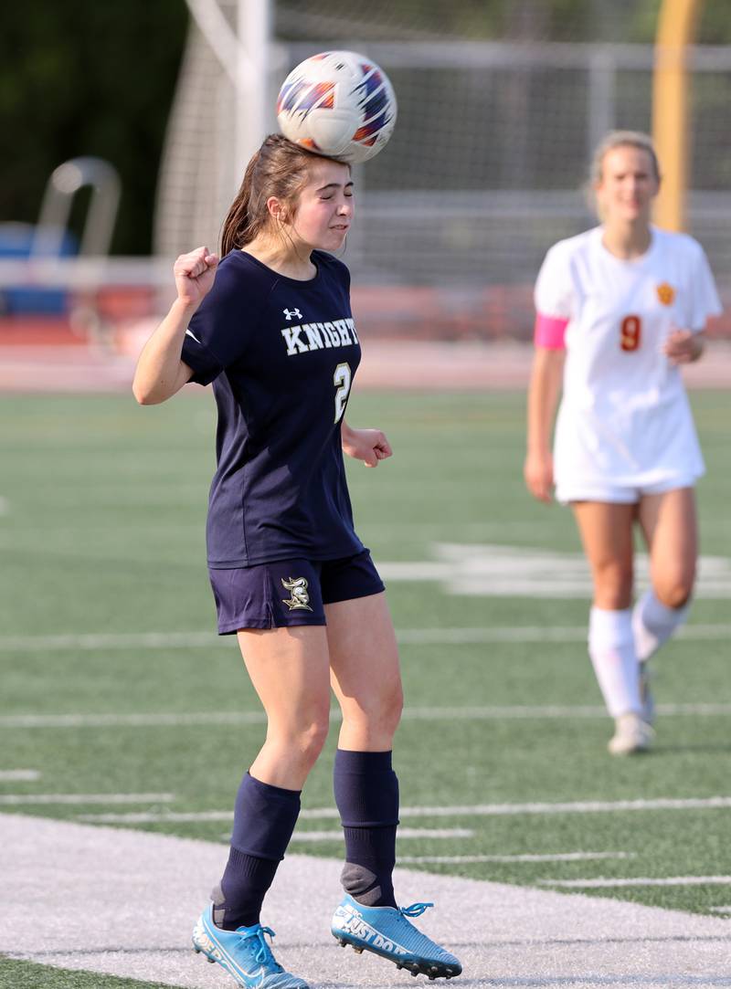 IC Catholic's Brynn Laluya (2) heads the ball during the IHSA Class 1A girls soccer super-sectional match between Richmond-Burton and IC Catholic at Concordia University in River Forest on Tuesday, May 23, 2023.