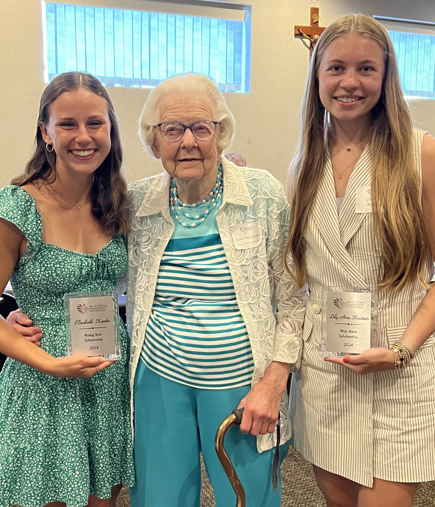 Ethel McConnell (center) poses for a photo with her scholarship recipients Ella Kamke (left) and Lily Keutzer.