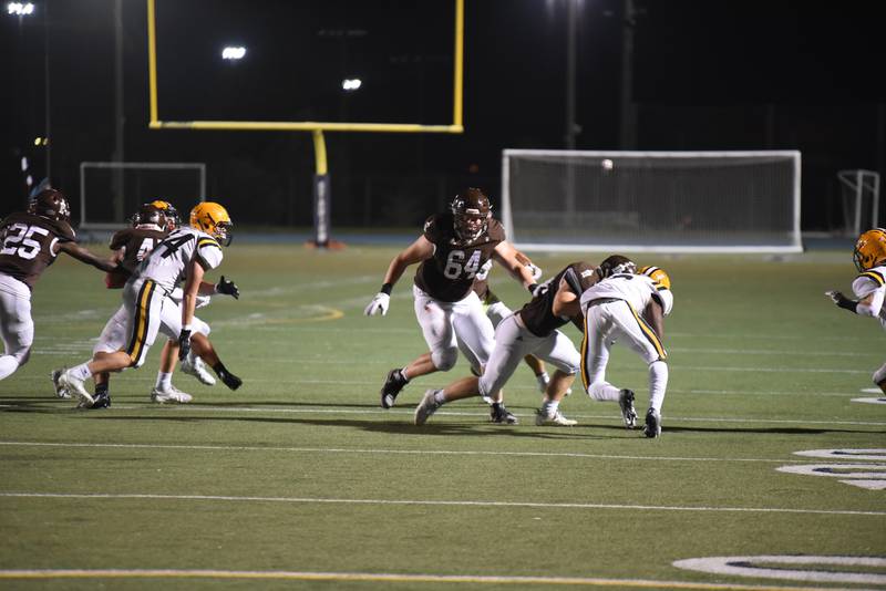 Joliet Catholic offensive lineman Anthony Birsa (64) prepares to clear a path in a game earlier this year. Birsa verbally committed to Northwestern last week.