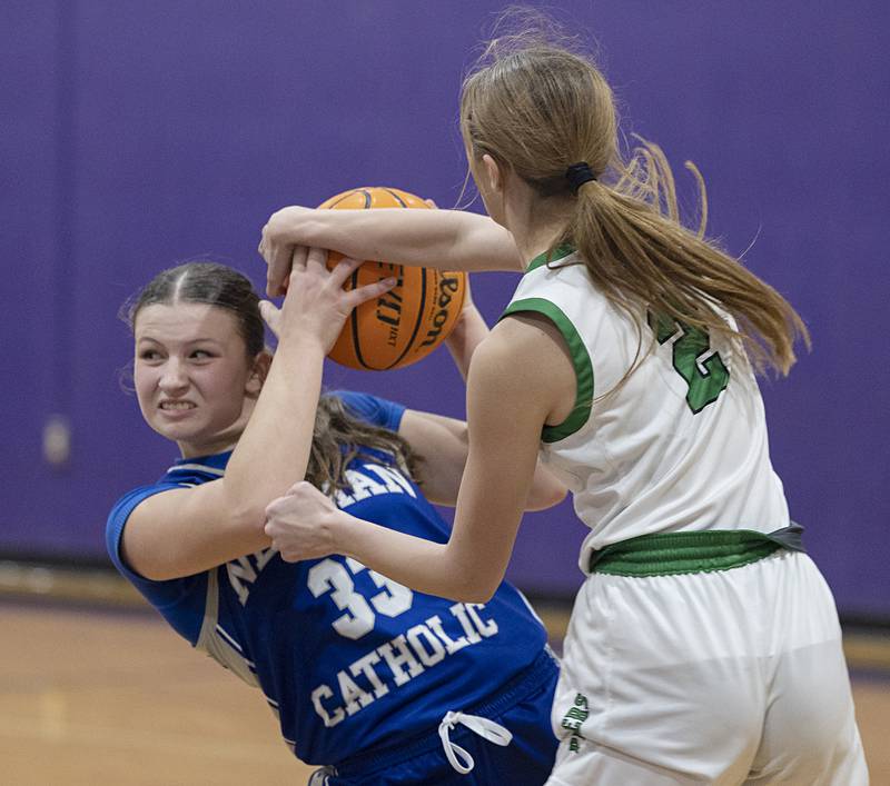 Newman’s Veronica Haley and Alleman’s Lindsey Britton fight for the ball Friday, Dec. 26, 2025, at the Duchesses Basketball Christmas Classic.