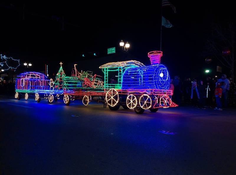 A lighted train glows along the La Salle Street route Friday, Nov. 24, 2023, during the Festival of Lights in downtown Ottawa.