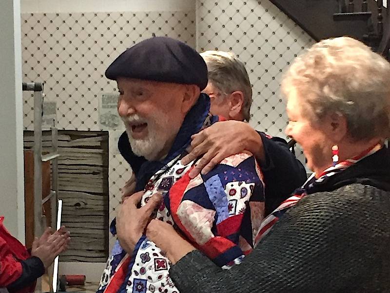 Robert S. Jackson receives a Valor Quilt from the Gazebo Valor Quilters of Huntley.