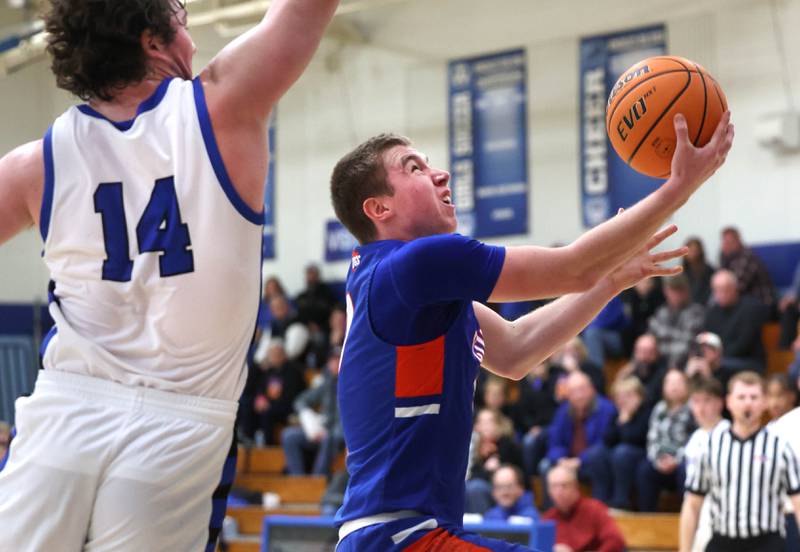 Genoa-Kingston's Nathan Kleba gets up a shot in front of Hinckley-Big Rock's Martin Ledbetter during their game Tuesday, Jan. 7, 2025, at Hinckley-Big Rock High School.