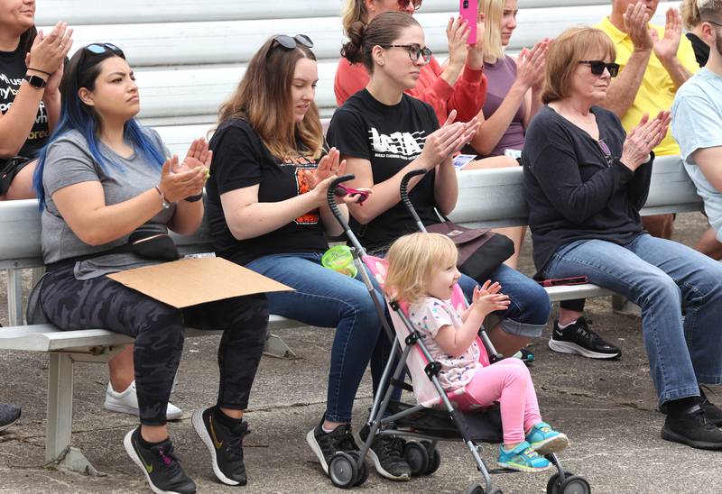 Attendees applaud speakers Saturday, June 11, 2022, during a March For Our Lives event at Hopkins Park in DeKalb. The March For Our Lives initiative advocates for, among other things, an end to gun violence, updated gun control legislation and policy targeting gun lobbyists.