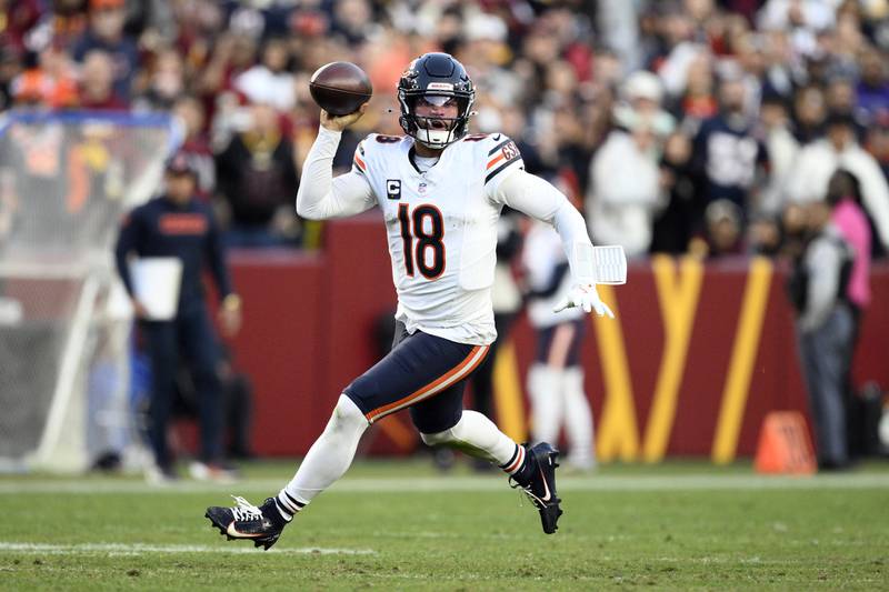 Chicago Bears quarterback Caleb Williams (18) looks for a receiver in the first half of an NFL football game against the Washington Commanders Sunday, Oct. 27, 2024, in Landover, Md. (AP Photo/Nick Wass)