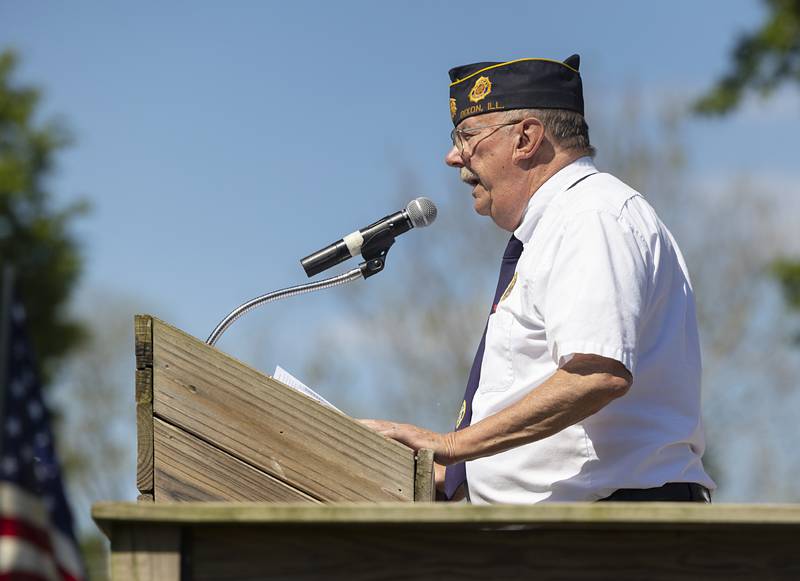 Dixon American Legion representative Mike Barney starts the Memorial Day observation Monday, May 25, 2026, at Oakwood Cemetery.