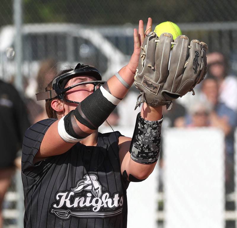 Kaneland pitcher Addison Coulter makes a catch on a popup during their game against Sycamore Wednesday, May 7, 2025, at Kaneland High School in Maple Park.
