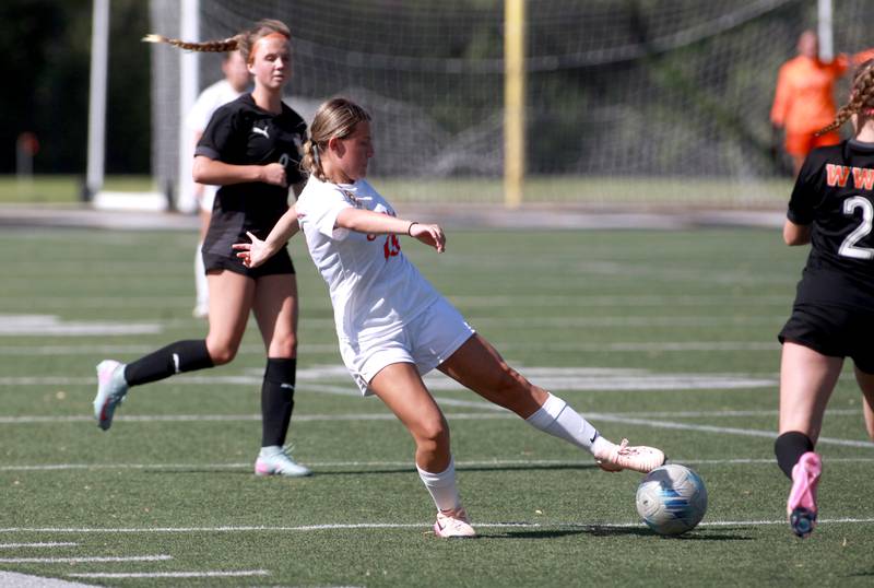 St. Charles East's Qori Strotkamp reaches for the ball during a game against Wheaton Warrenville South on Friday, May 16, 2025 in Wheaton.
