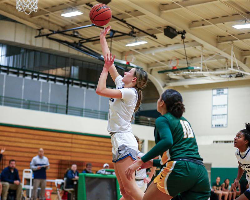 Oswego East's Aubrey Lamberti (1) puts in a layup at the York Thanksgiving Tournament. Nov 13, 2023.