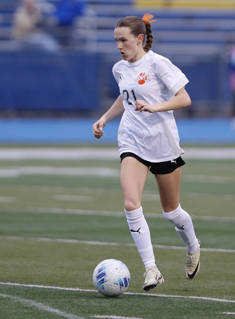 Wheaton Warrenville South's Ashlyn Adams (21) handles the ball during the girl's varsity soccer match between Lyons Township and Wheaton Warrenville South high schools on Thursday, March 27, 2025 in Western Springs.