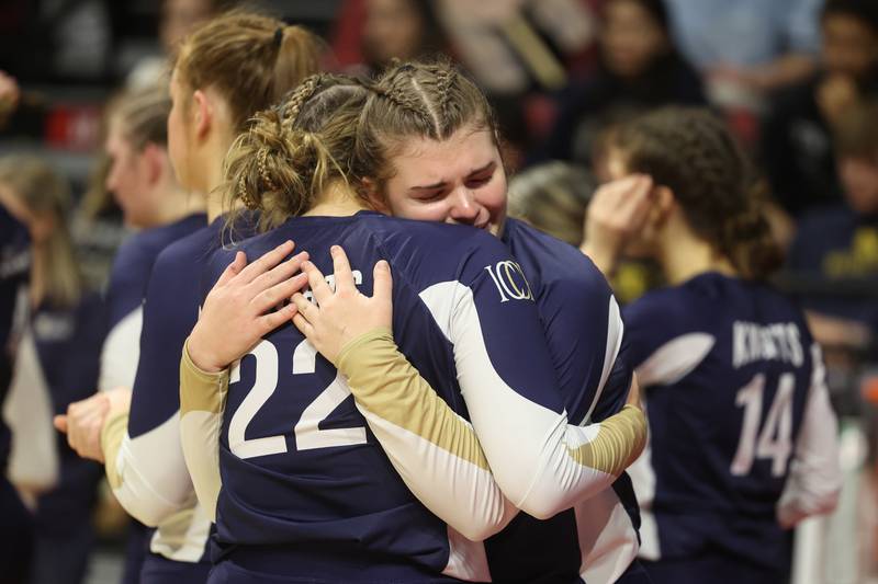 IC Catholic’s Jenny Formelt (22) consoles Emily Carling after their loss against Mater Dei in the Class 2A Volleyball Championship match on Saturday, Nov. 11, 2023 in Normal.