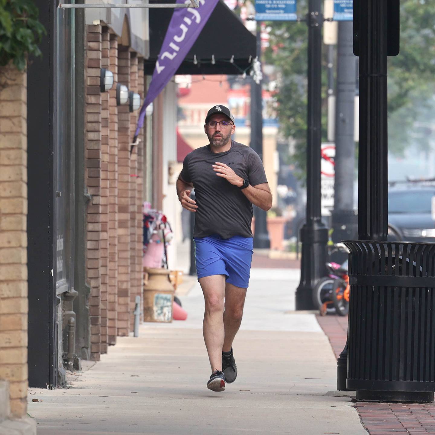 Shawn Beck, from DeKalb, runs west Wednesday, June 28, 2023, on Lincoln Highway between First and Second Streets in DeKalb. Beck recently completed his goal of running every street in DeKalb County.