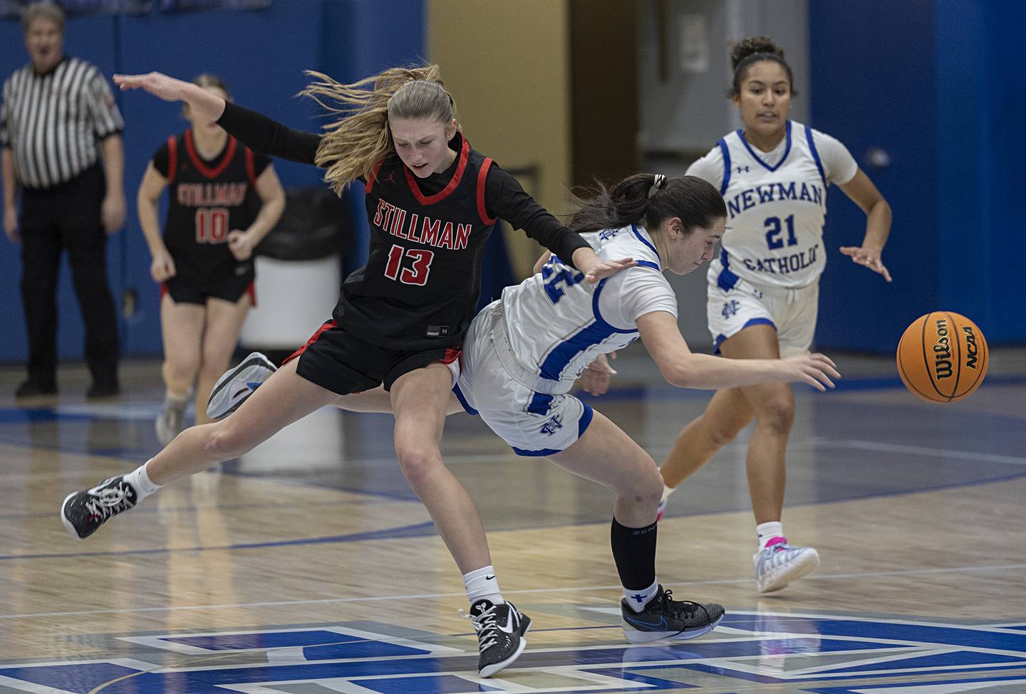Newman’s Anna Propheter and Stillman Valley’s Lillian Green go down in a heap Monday, Feb. 2, 2026.
