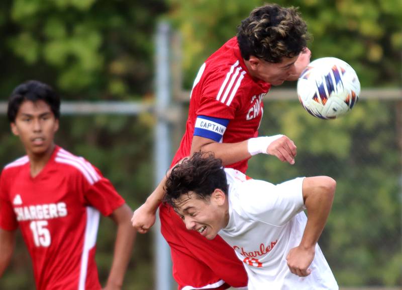Dundee-Crown’s Angel Landeros, right top, battles St. Charles East’s Huxley Kapoor, bottom right, for the ball as Dundee-Crown’s Damian Ramos keeps an eye on the action in IHSA Class 3A Regional Championship soccer at Dundee-Crown High School in Carpentersville on Saturday, October 25, 2025.