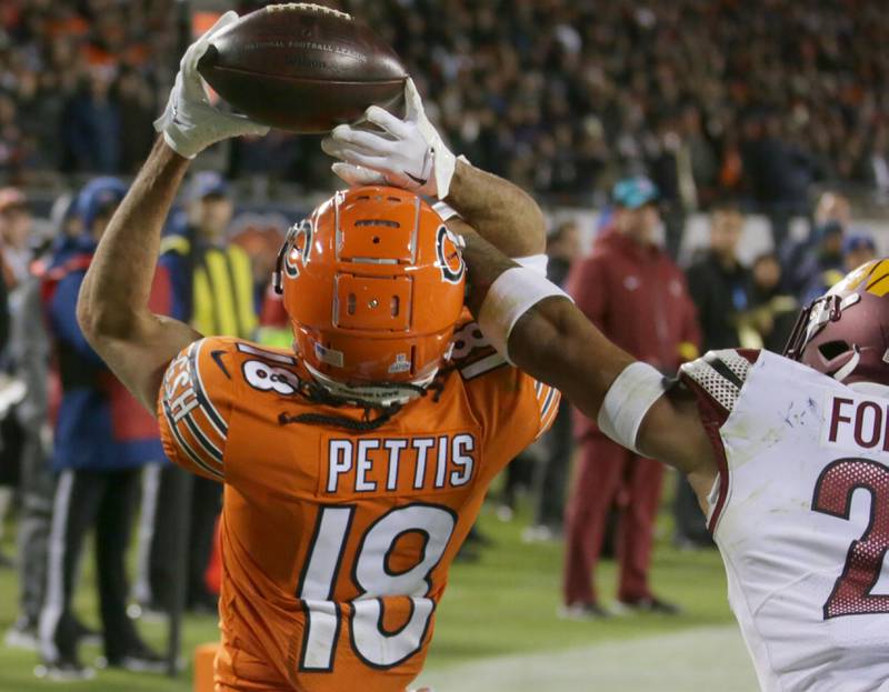 Chicago Bears Dante Pettis (18) makes a catch over Washington Commanders safety Darrick Forrest (22) on Thursday, Oct. 13, 2022 at Soldier Field.