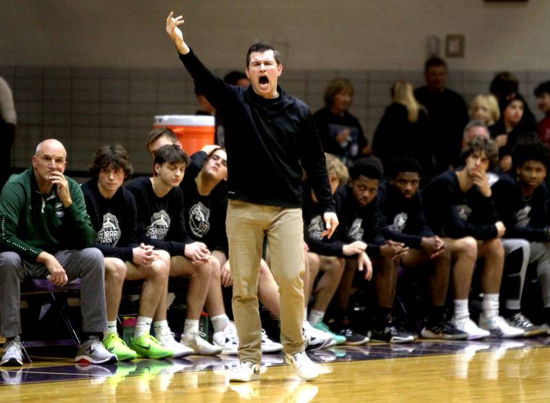 Glenbard West Head Coach Jason Opoka yells to his team during a game at Downers Grove North on Friday, Jan. 13, 2023.