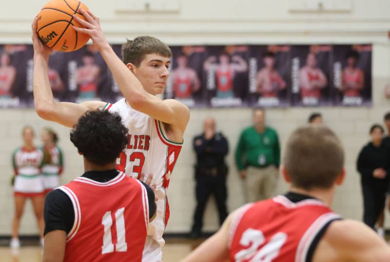 L-P's Gavin Stokes looks to pass the ball around Ottawa's Hezekiah Joachim on Friday, Jan. 9, 2026 in Sellett Gymnasium at L-P High School.