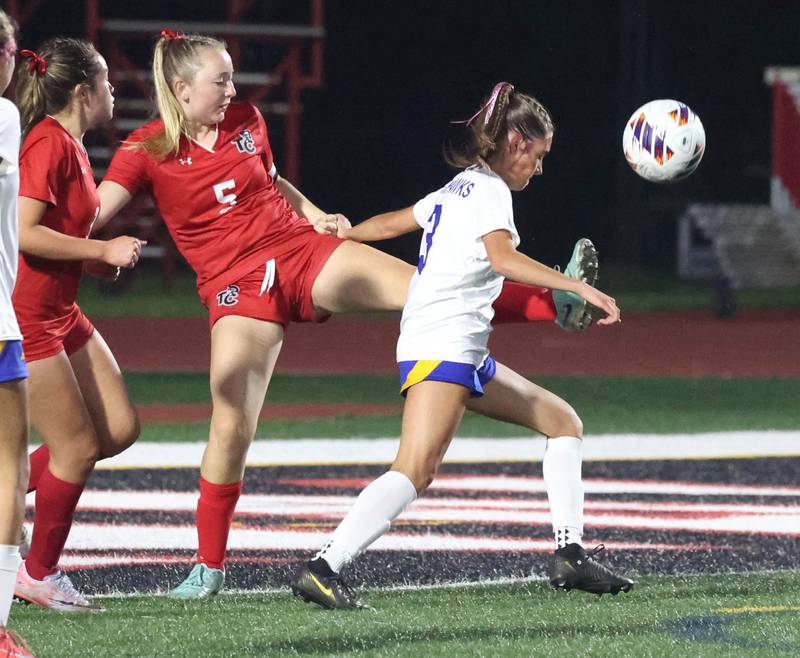 Timothy Christian's Samantha Drye kicks the ball past Johnsburg's Charlie Eastland Thursday, June 5, 2025, during their IHSA Class 1A state semifinal game at North Central College in Naperville.