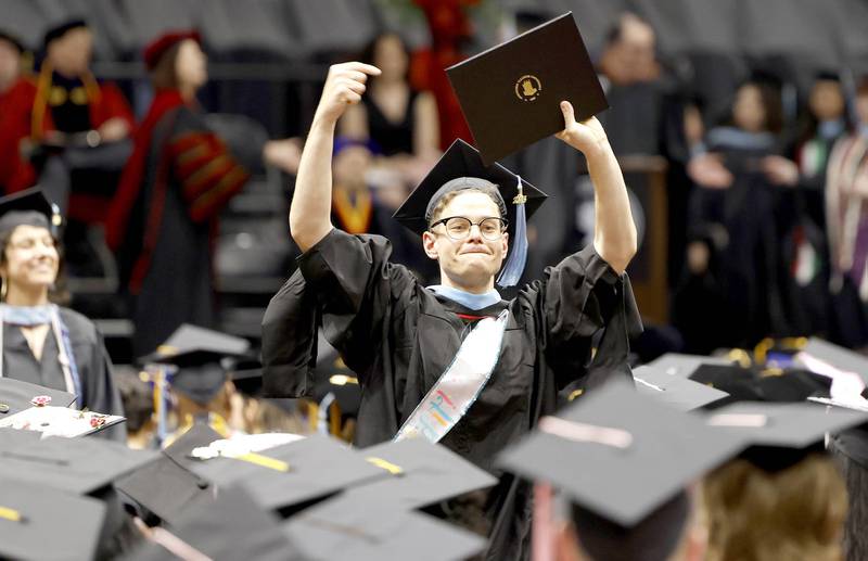Northern Illinois University graduate students collected their diplomas during the Class of 2023 Commencement May 12, 2023 at the NIU Convocation Center in DeKalb.