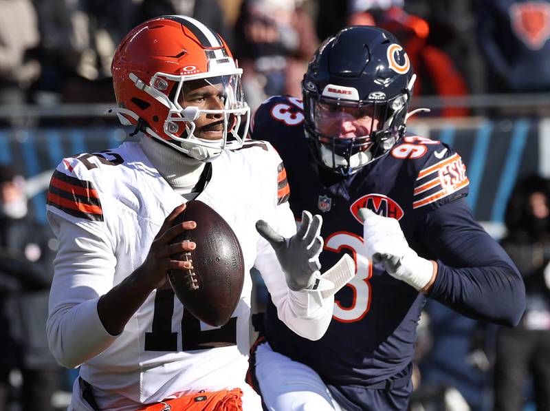 Chicago Bears defensive end Joe Tryon-Shoyinka closes in on Cleveland Browns quarterback Shedeur Sanders during their game Sunday, Dec. 14, 2025, at Soldier Field in Chicago.