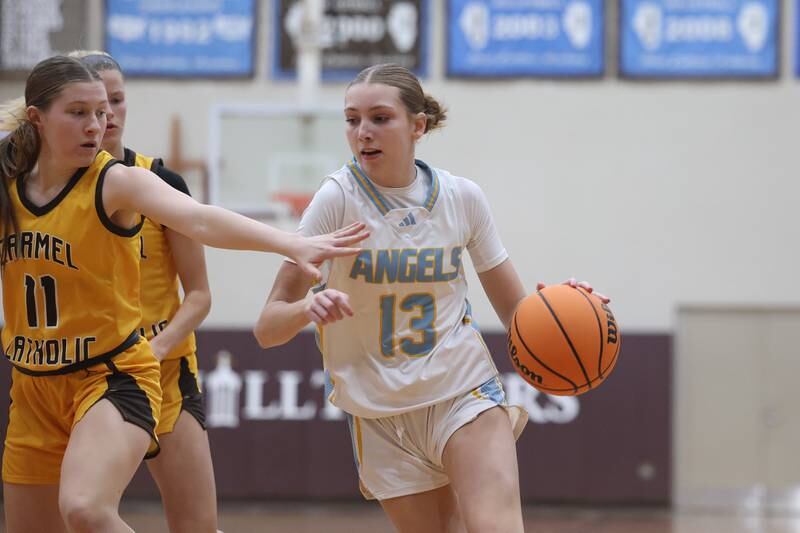 Joliet Catholic’s Abigail Dulinsky makes a move to the paint  against Carmel on Wednesday, Jan 15, 2025 in Joliet.