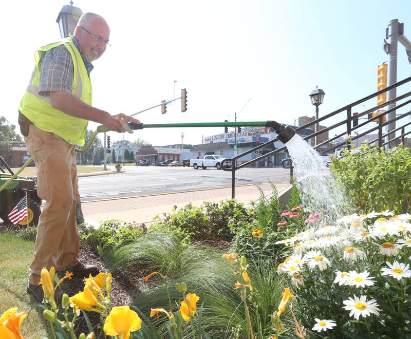 Ray Mabry Mayor of the City of Princeton, waters flowers in front of the United States Post Office on Wednesday, June 21, 2023 in Princeton.