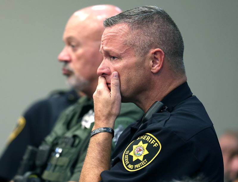 DeKalb County Sheriff Andy Sullivan becomes emotional as he listens to Diane Caporaso, mother of Christina Musil, deliver her victims impact statement Tuesday, Aug. 26, 2025, during the sentencing hearing for Nathan P. Sweeney at the DeKalb County Courthouse in Sycamore. Sweeney received the maximum 14 years for driving under the influence and causing the 2024 crash that killed DeKalb County sheriff’s deputy Musil.