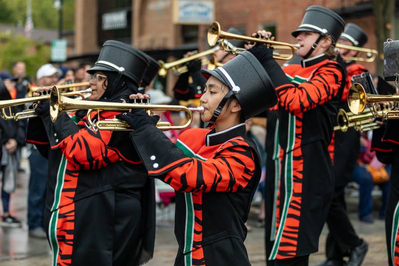 Trumpet player Hannah Hoang marches with the Plainfield East High School Marching Bengals during the Plainfield Community Homecoming Parade on Sept. 28, 2024.