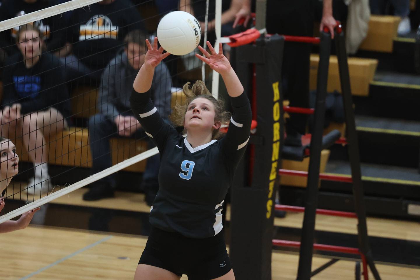 Joliet Catholic’s Jess Horn sets the ball against St. Laurence in the Class 3A Hinsdale South Super-sectional on Friday