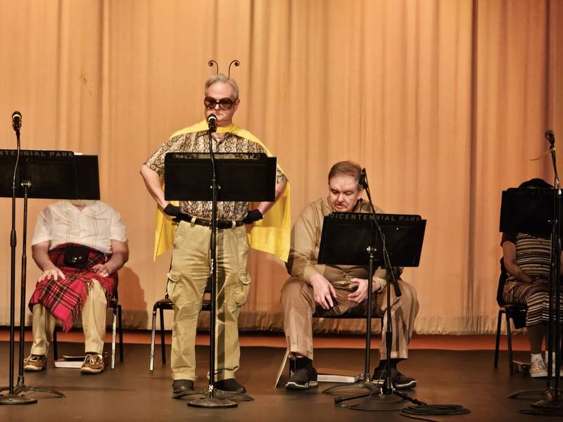 Duanne Walton of Morris (standing) returns as superhero Bee Man in WriteOn Joliet's radio-style theater performance of "We Can Be Heroes," Friday and Saturday at the Billie Limacher Bicentennial Park Theatre in Joliet.