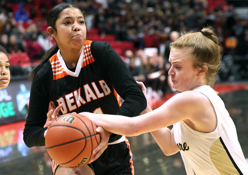 DeKalb's Alicia Johnson is fouled by Sycamore's Mallory Armstrong during the First National Challenge Friday, Jan. 27, 2023, at The Convocation Center on the campus of Northern Illinois University in DeKalb.