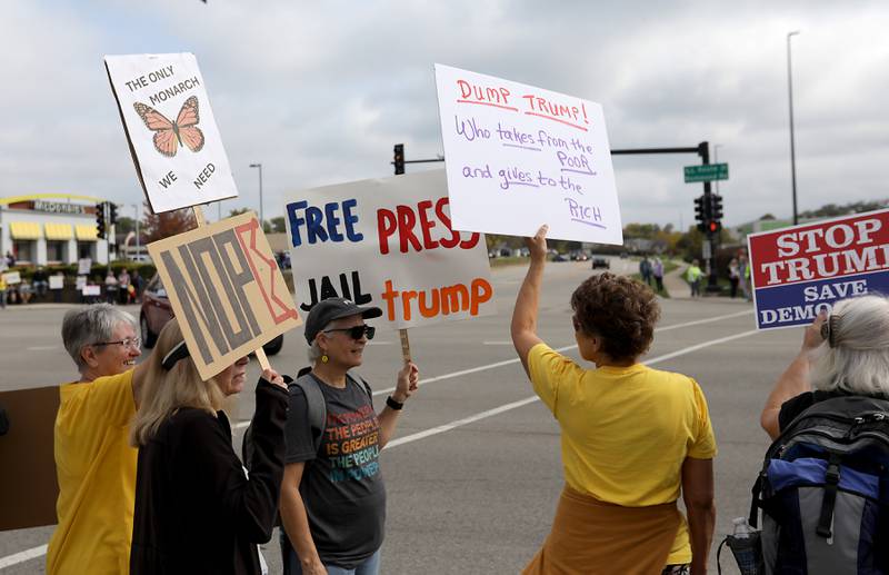 Protesters line Route 31 during a "No Kings” protest rally on Saturday, Oct. 18, 2025, in McHenry. The protest drew thousands of protesters to the area to protest the policies of President Donald Trump.