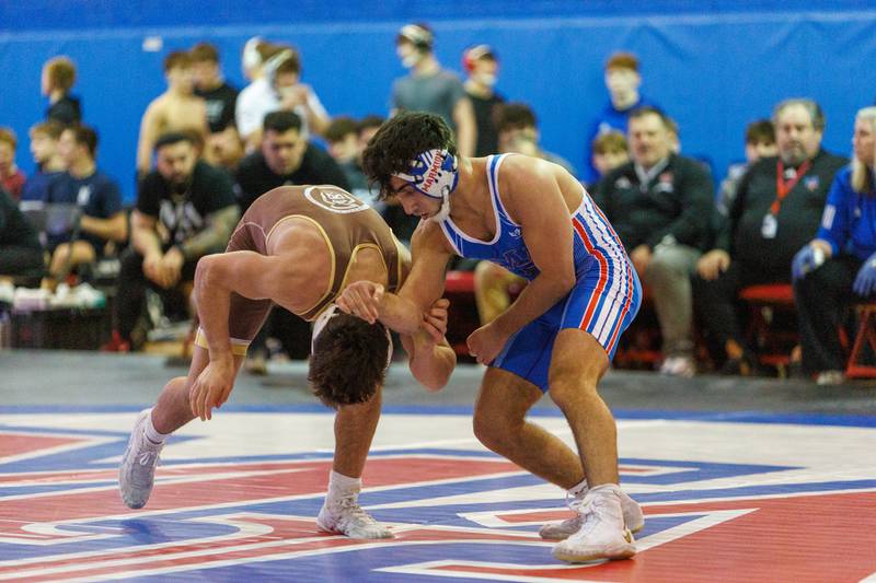 Mt. Carmel's Justin Williamson and Montini's Zach Stewart  competes in the 150 lb match  at the Marmion Class  2A Dual Team Sectional on Thursday, Feb. 5,2026 in Aurora.