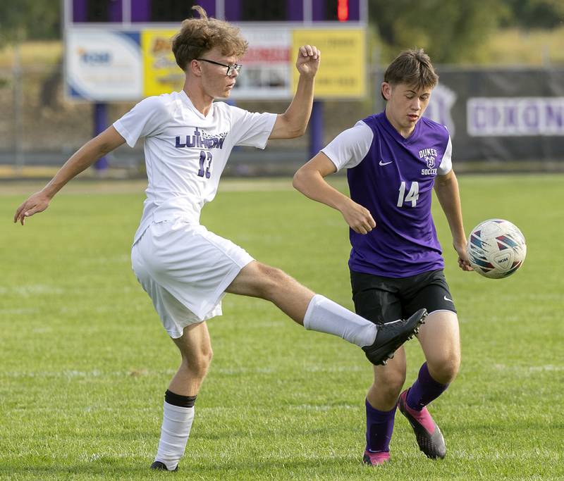 Dixon’s Landon Aldridge works against Rockford Lutheran’s Carson Stevens Wednesday, Sept. 18, 2024.