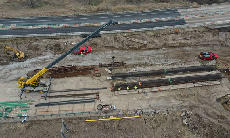 Crews with the Illinois Department of Transportation work on replacing a bridge structure on Interstate 180 over the Tiskilwa Bottom Road on Tuesday, March 18, 2025. According to IDOT, the $24.2 million dollar project includes replacing beams and decking on the current bridge.  During the replacement, only one-lane of traffic in each direction is using the northbound lanes as work happens on the southbound bridges. When that work is complete, traffic will be switched to the southbound lanes to begin work on the northbound bridges.