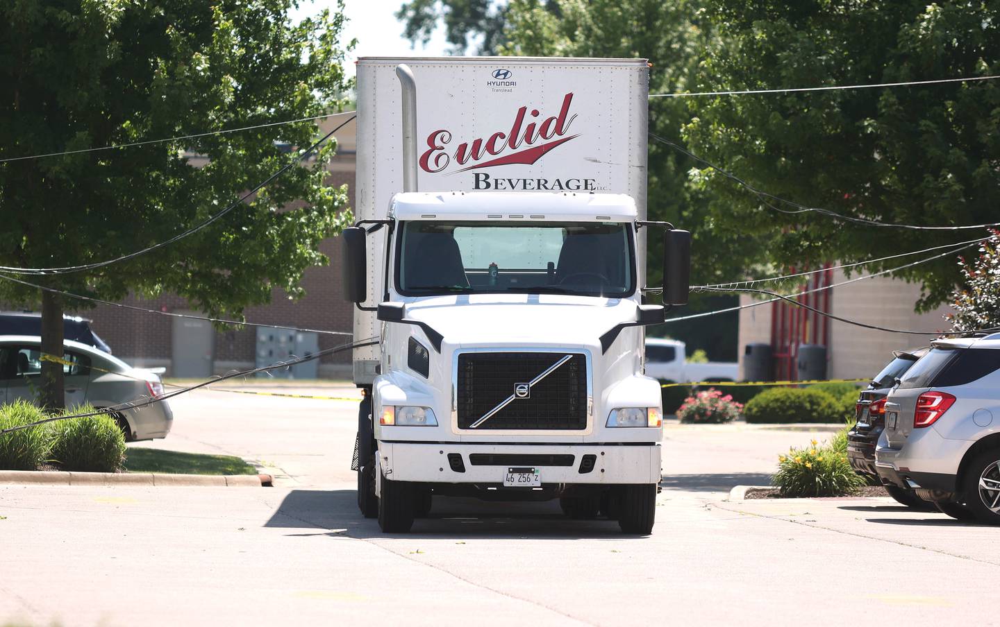 A semi-trailer truck sits in a parking lot on the west side of Sycamore Road across from the entrance to Walmart Tuesday, June 21, 2022, draped with powerlines after it struck andpulled down the wires onto Sycamore Road. The road was shut down from the Walmart entrance to Barber Greene Road.