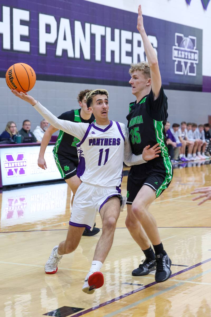 Manteno's Braden Campbell drives toward the basket against Bishop McNamara's Richard Darr during the Fightin' Irish's 61-24 victory over Manteno on Tuesday, Jan. 13, 2026.