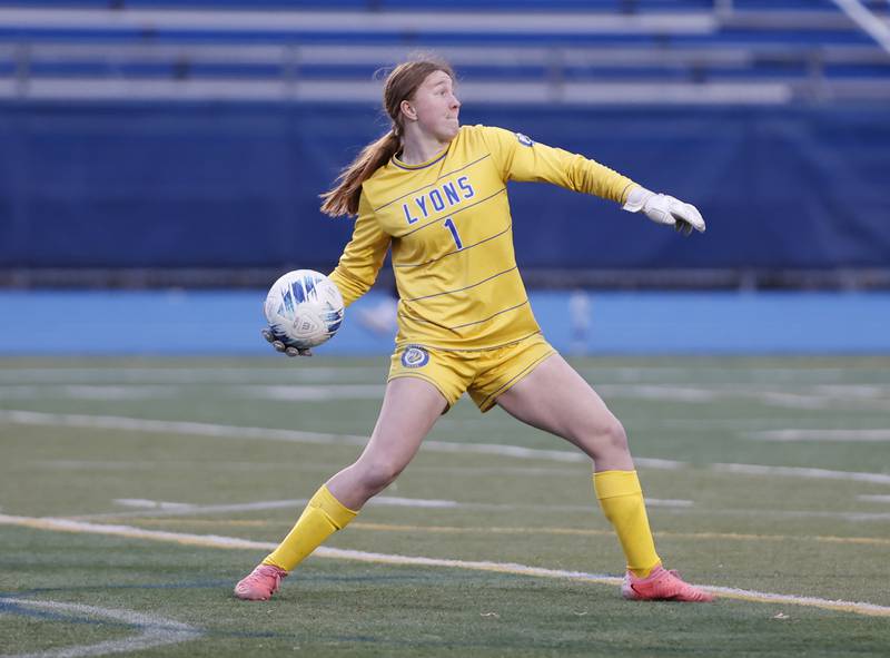 Lyons Township's Anna Bigenwald puts the ball back into play during the girl's varsity soccer match between Lyons Township and Wheaton Warrenville South high schools on Thursday, March 27, 2025 in Western Springs.