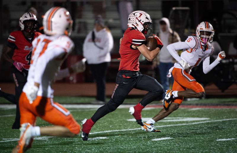 Bradley-Bourbonnais' Issac Allison, center, carries the ball on a play against Shephard in a Class 6A playoff game on Friday, October 31, 2025.