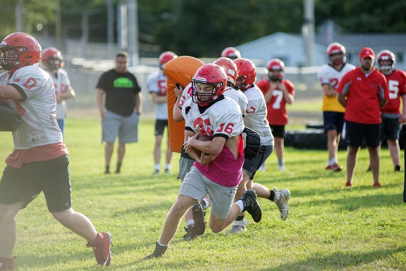 Amboy players run through drills Thursday, July 28, 2022 at the high school. First day of IHSA football practice is just over a week away for local teams.