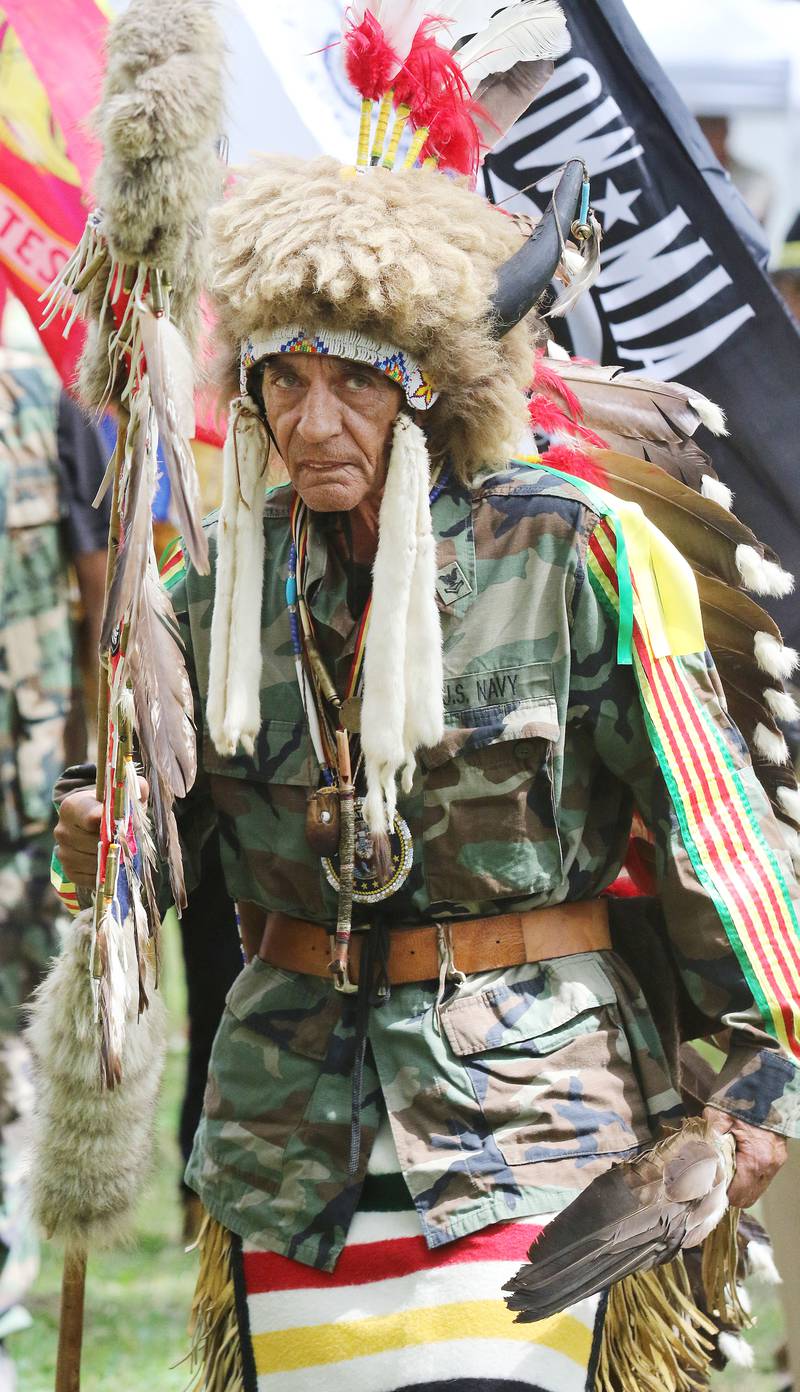 Wamblee Loux, of Vermillion, SD., a U.S. Navy veteran and member of the Oglala Lakota Tribe walks in the Grand Entry during the 30th Annual Potawatami Trails Pow-Wow at Shiloh Park on Saturday, August 26th in Zion. 
Photo by Candace H. Johnson for Shaw Local News Network