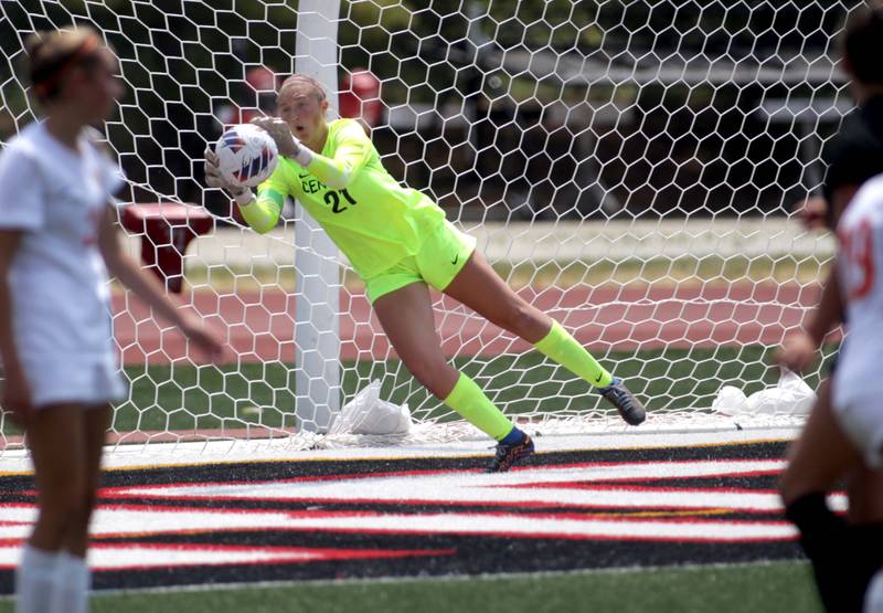 Crystal Lake Central goalkeeper Addison Cleary makes a save during a Class 2A girls state soccer semifinal against Benet at North Central College in Naperville on Friday, June 2, 2023.