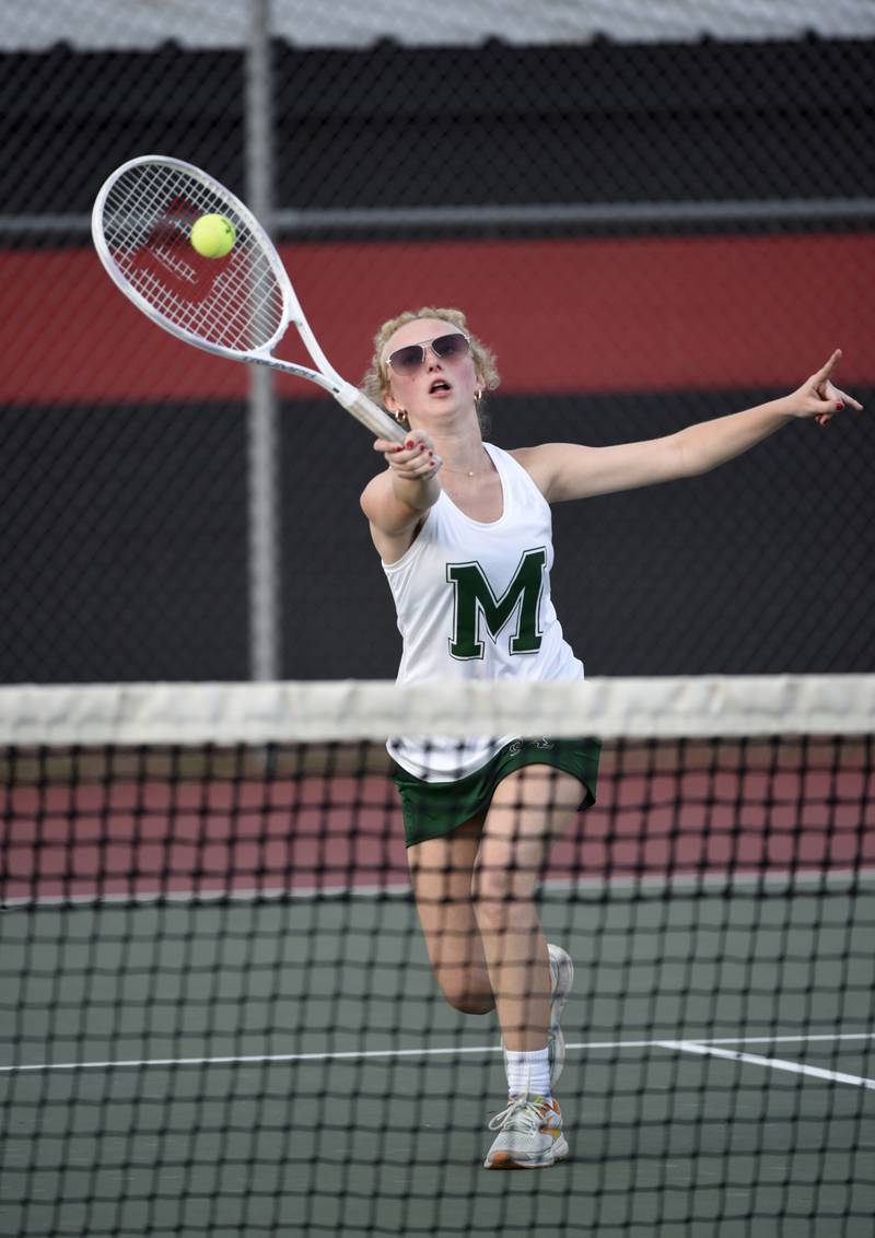 Bishop McNamara's Stella Kruse makes a return hit in the 3rd place doubles match of the All-City tournament against Bradley-Bourbonnais on Wednesday, October 1, 2025.