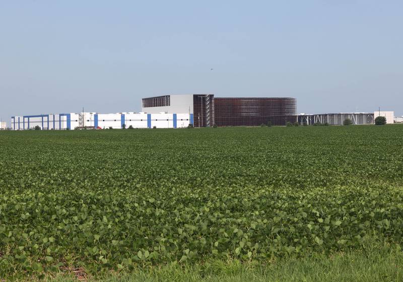 A field between Webster Road and Peace Road along East Gurler Road with the Kraft Heinz Company distribution center in the background Friday, July 12, 2024, in DeKalb.