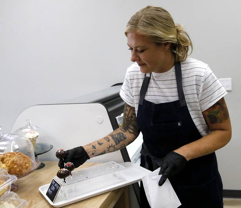 Rachel Skubiszewski waits on a customer on Friday, June 27, 2025, at the recently opened Black Market Bakery in downtown Crystal Lake.