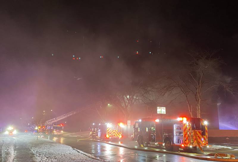 Heavy smoke blurs the air in the 900 to 1000 blocks of West Hillcrest Drive on Sunday, Dec. 22, 2024, in DeKalb. A fire broke out apartment in the three-building complex. Firefighters from across northern Illinois responded to the blaze that impacted multiple residents, authorities said.