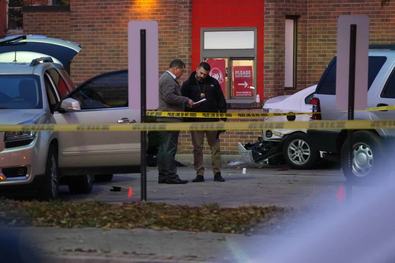 Police work the crime scene of a shooting outside Wendy's at West Jefferson and North Center streets Tuesday, Nov.16, 2021 in Joliet.