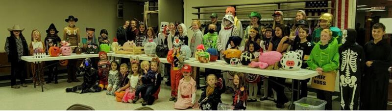 Members of Brookfield Aces 4-H Club showing off their costumes and pumpkins at their October meeting.