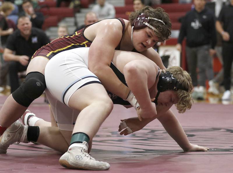 Richmond-Burton’s Colin Kraus controls Marian Central’s Kaleb Eckman in the 285-pound third-place match of the IHSA 1A Marengo Wrestling Regional on Saturday, Feb. 8, 2025, at Marengo High School.