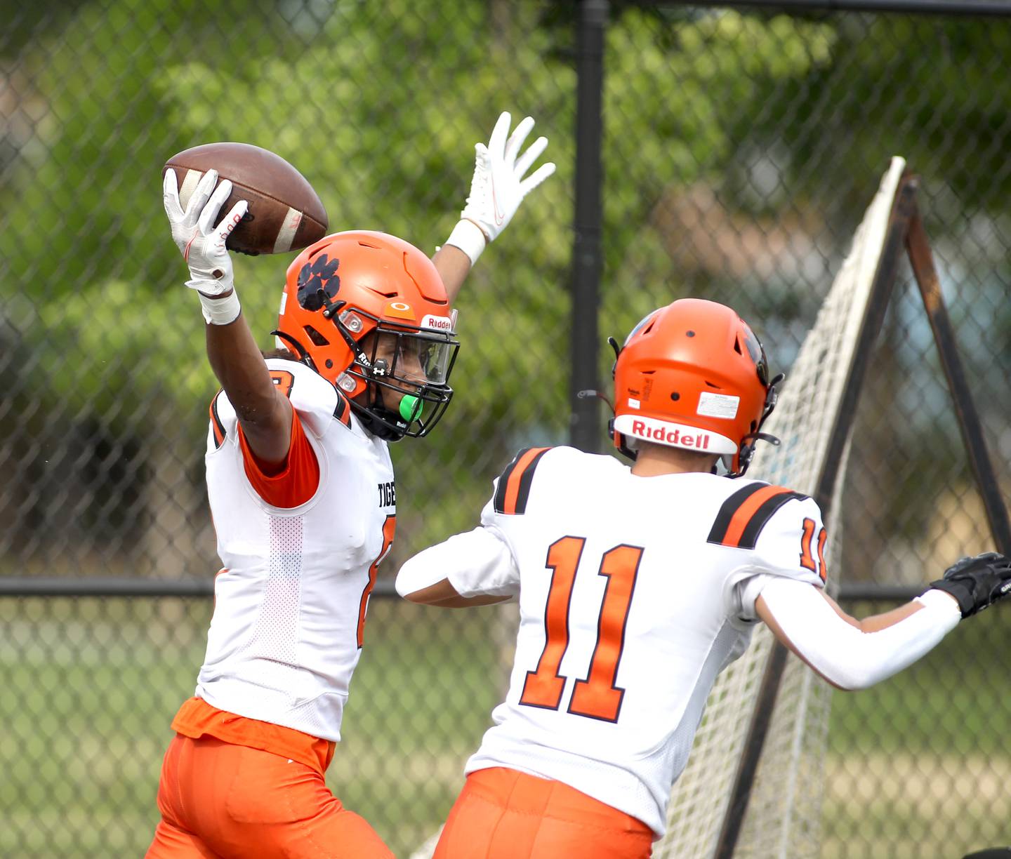 Wheaton Warrenville South’s Braylen Meredith (left) celebrates a touchdown during a game against Simeon at Gately Stadium in Chicago on Saturday, Aug. 27, 2022.